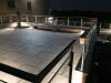 Top_patio_at_night_with_granite_set_pavers_and_feature_ballastrade